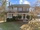 Charming two-story home with a welcoming front porch and a well-maintained yard at 4319 White Cliff Ln, Durham, NC 27712