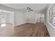 Open living room showcasing wood floors and lots of natural light at 4319 White Cliff Ln, Durham, NC 27712