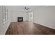Cozy living room features a fireplace and wood flooring at 4319 White Cliff Ln, Durham, NC 27712