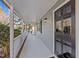 Charming covered front porch of a home with a black door and light-blue siding at 4319 White Cliff Ln, Durham, NC 27712