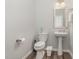 Clean half-bathroom with modern fixtures including pedestal sink and toilet at 501 Historic Dr, Hillsborough, NC 27278