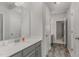 Neutral bathroom featuring a long vanity with sink, faucet, and plenty of storage, along with updated flooring at 501 Historic Dr, Hillsborough, NC 27278