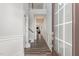 Bright foyer with hardwood floors, white trim, and staircase with a view of the living area at 501 Historic Dr, Hillsborough, NC 27278