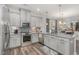 Modern kitchen features granite countertops, stainless steel appliances, and stylish backsplash at 501 Historic Dr, Hillsborough, NC 27278