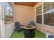 Enclosed outdoor porch with ceiling and walls, complete with furniture and a built-in gas fire pit at 501 Historic Dr, Hillsborough, NC 27278