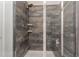 Beautiful tiled shower features a shower head, soap and shampoo shelves, and a convenient bench seat at 501 Historic Dr, Hillsborough, NC 27278