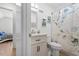 Bathroom featuring a vanity with storage, leafy shower curtain and a view into the bedroom at 506 W Gilbreath St, Graham, NC 27253