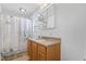 Well-lit bathroom with a single vanity and a shower-tub combination at 506 W Gilbreath St, Graham, NC 27253