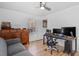 Bright bedroom featuring a ceiling fan, desk and a large window at 506 W Gilbreath St, Graham, NC 27253
