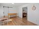 Bright and airy living room with hardwood floors and neutral decor at 506 W Gilbreath St, Graham, NC 27253