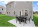 Outdoor patio with seating area for six, showcasing the backyard and outdoor living space at 508 Olivia Crossing Ct # 17, Four Oaks, NC 27524