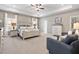 Spacious main bedroom with tray ceiling, neutral decor, and ample natural light for a relaxing retreat at 508 Olivia Crossing Ct # 17, Four Oaks, NC 27524