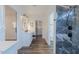 Bathroom featuring gray tiled shower, double vanity and walk-in closet at 5171 S River Rd, Lillington, NC 27546