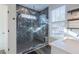 Bathroom features a glass shower with gray tile and a bench at 5171 S River Rd, Lillington, NC 27546