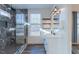 Bathroom featuring glass shower, window, and tiled floor at 5171 S River Rd, Lillington, NC 27546