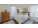 Cozy bedroom with wood floors, natural light, and classic furnishings, creating a relaxing space at 5171 S River Rd, Lillington, NC 27546