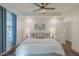 Bedroom features a ceiling fan, two windows, and an art piece at 5171 S River Rd, Lillington, NC 27546
