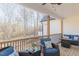 Outdoor deck featuring comfortable seating, stylish decor, and a view of the surrounding landscape at 5171 S River Rd, Lillington, NC 27546
