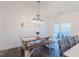 Dining area with rustic wooden table, stylish seating, and a view of the outdoor patio at 5171 S River Rd, Lillington, NC 27546