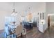 Well-lit dining area with adjacent kitchen and stainless steel appliances at 5171 S River Rd, Lillington, NC 27546