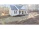 Beautiful home with stylish exterior, complemented by a well-manicured lawn at 5171 S River Rd, Lillington, NC 27546