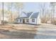 Charming home exterior featuring a covered porch, a manicured front yard, and a traditional design at 5171 S River Rd, Lillington, NC 27546