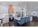Bright kitchen features white cabinets, stainless steel appliances, wooden accents, and island seating at 5171 S River Rd, Lillington, NC 27546