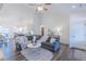 Open living space with wood flooring, bright lighting, and an airy atmosphere at 5171 S River Rd, Lillington, NC 27546
