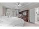 Bright bedroom featuring neutral walls, a ceiling fan, and access to an outdoor patio at 5309 Shoreline Ct, Holly Springs, NC 27540