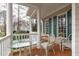 Inviting front porch with comfortable seating, a swing, and a welcoming atmosphere at 5309 Shoreline Ct, Holly Springs, NC 27540