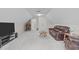 Finished attic space is used as a living room area with couches, a coffee table and TV at 5309 Shoreline Ct, Holly Springs, NC 27540