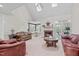 Spacious living room with vaulted ceilings, fireplace, and access to outdoor patio at 5309 Shoreline Ct, Holly Springs, NC 27540