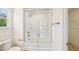 Bathroom with tub-shower combo and glass doors at 542 Winding Crk Dr, Lillington, NC 27546