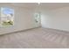 Spacious bedroom with two windows offering natural light and views of the outdoors at 542 Winding Crk Dr, Lillington, NC 27546