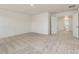Large carpeted room featuring double doors leading to another room at 542 Winding Crk Dr, Lillington, NC 27546