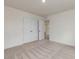 Bedroom with neutral carpet, closet, and doorway to another room at 542 Winding Crk Dr, Lillington, NC 27546