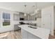 Modern kitchen boasts gray cabinets, a white countertop island, and stainless steel appliances at 542 Winding Crk Dr, Lillington, NC 27546