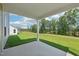 Covered patio overlooking a lush green backyard at 542 Winding Crk Dr, Lillington, NC 27546