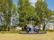 Community playground with modern equipment, providing a safe and fun recreational area at 542 Winding Crk Dr, Lillington, NC 27546