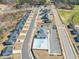 Community aerial view showing a pool, clubhouse, parking, and modernly built homes at 612 Jasmine St, Wendell, NC 27591