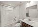 Bright bathroom featuring a shower-tub combo and a single sink vanity with good lighting at 612 Jasmine St, Wendell, NC 27591