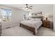 Serene bedroom with large windows, natural light, and stylish wooden furniture at 612 Jasmine St, Wendell, NC 27591