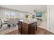 Bright open-concept area with a kitchen island, dining area, and comfortable living space at 612 Jasmine St, Wendell, NC 27591