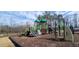 Enjoy the playground with green features set amongst mature trees at 612 Jasmine St, Wendell, NC 27591