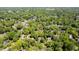 An aerial shot of a residential area with tree-lined streets and well-maintained homes and yards at 826 Warwick Ct, Burlington, NC 27215