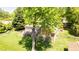 Well-maintained backyard featuring a brick home with a spacious wooden deck and landscaped lawn at 826 Warwick Ct, Burlington, NC 27215