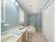 Bright bathroom with a large soaking tub, tile floors, and a double sink vanity at 826 Warwick Ct, Burlington, NC 27215