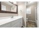 Bathroom with a white vanity, tile floor, and shower at 826 Warwick Ct, Burlington, NC 27215