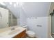 Bathroom featuring white walls and fixtures, a wooden vanity, and a stand up shower at 826 Warwick Ct, Burlington, NC 27215