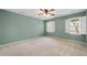 Bedroom featuring a ceiling fan and windows with natural light at 826 Warwick Ct, Burlington, NC 27215